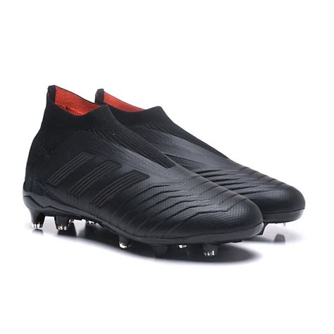 all black adidas soccer boots.